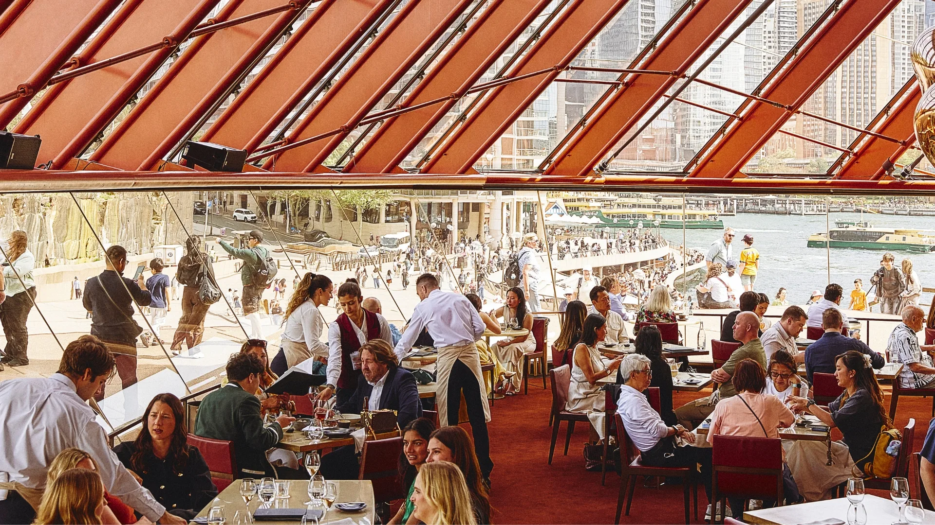 The light-filled, harbourside dining room of Bennelong, Sydney, open on Christmas Day 2025