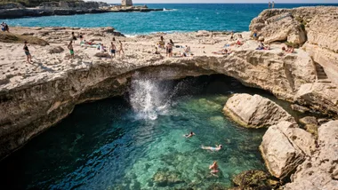 people jumping into puglia ocean and swimming