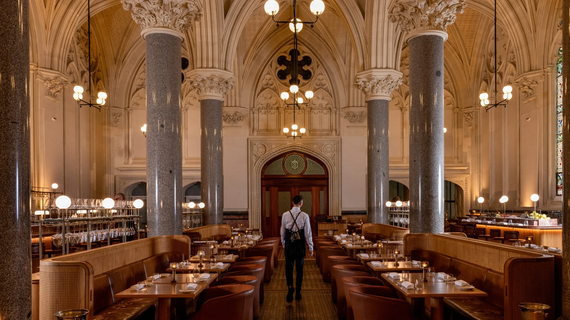 Long pillars, tiled floors, high ceilings set the room at Reine & La Rue in Melbourne's CBD
