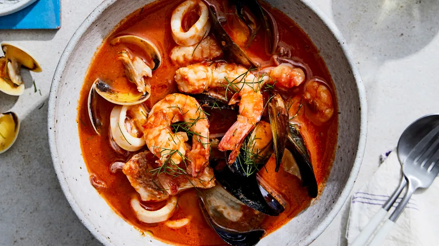 A vibrant bowl of brodetto with calamari rings, prawns and mussels.