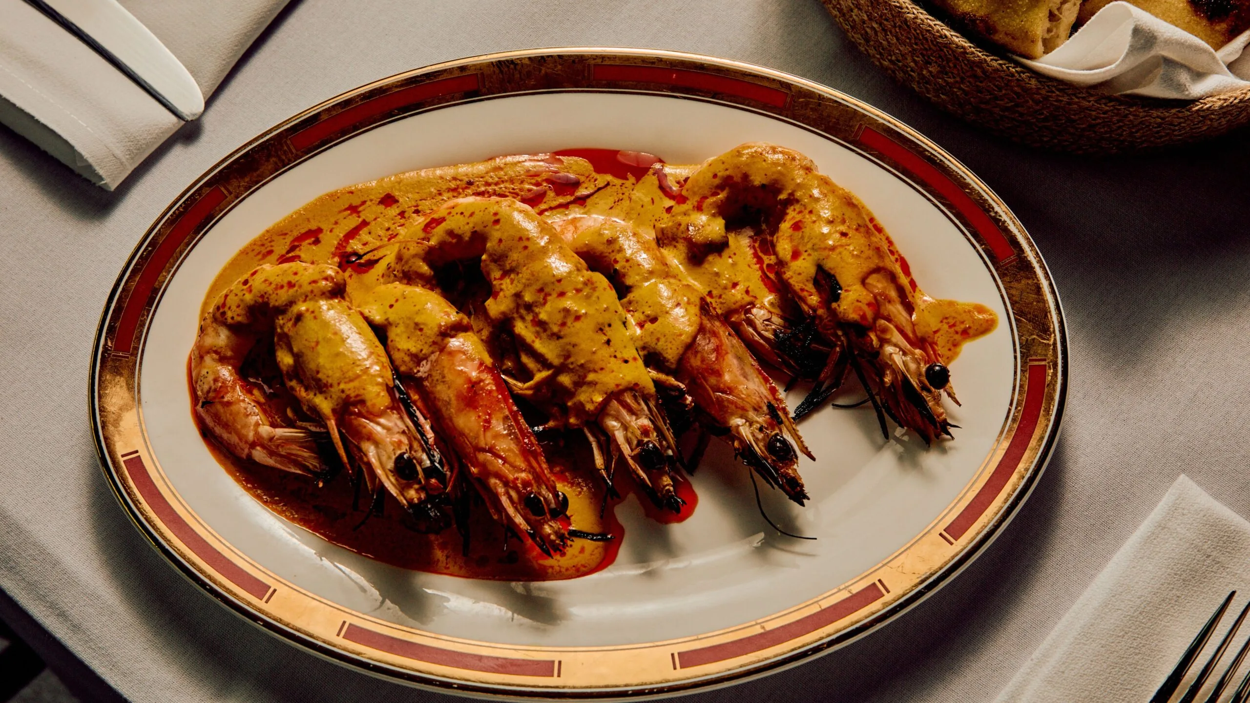 Chingri malaikari (wood-fired king prawns with turmeric and coconut) at Melbourne's new Kolkata Cricket Club