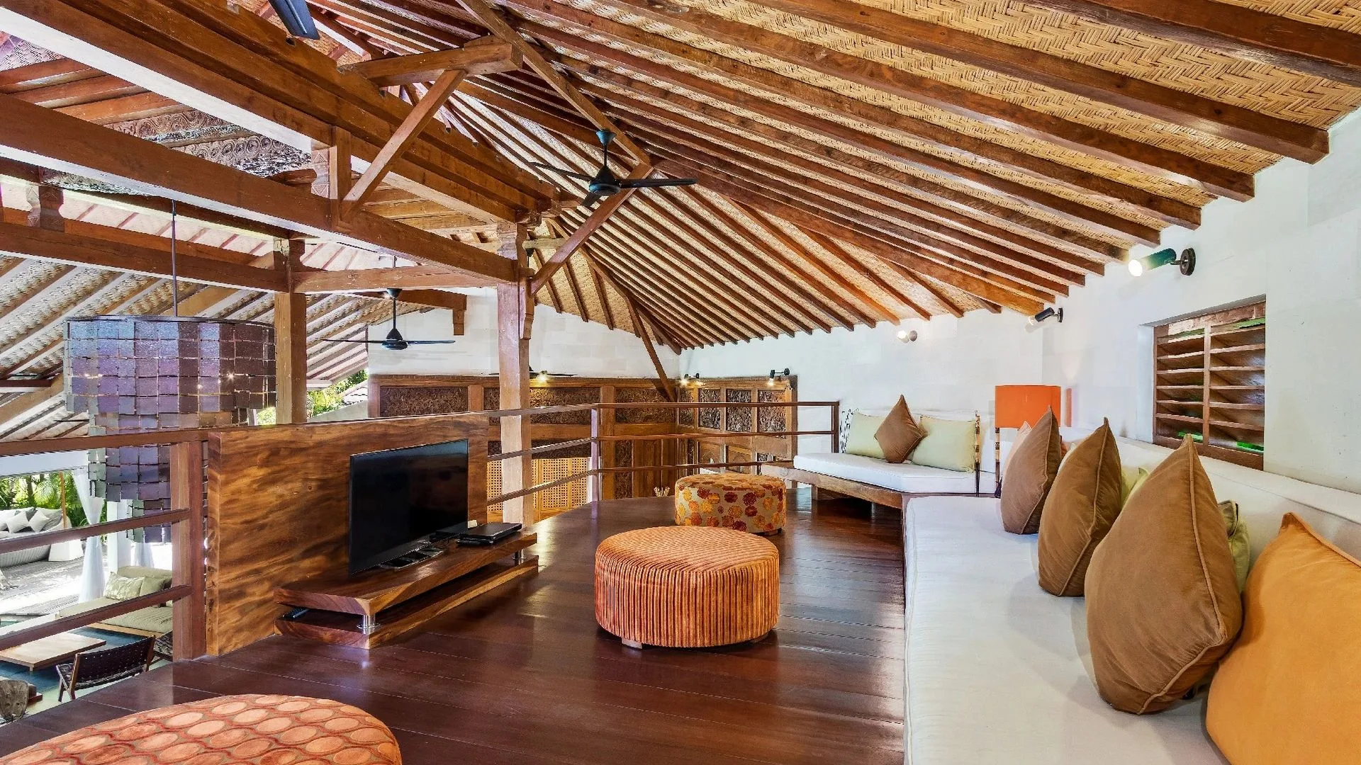 loft of a villa, wooden beams and white walls