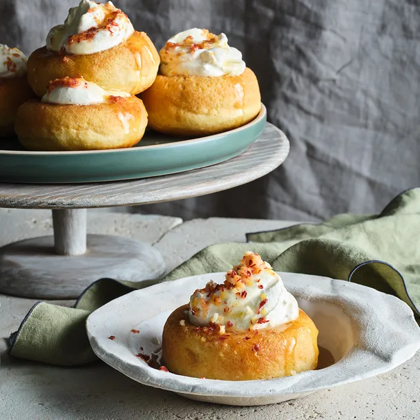 Fennel, honey and ouzo baba with peaches and cream