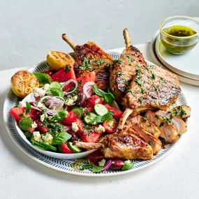 Oregano and honey pork cutlets with watermelon Greek salad