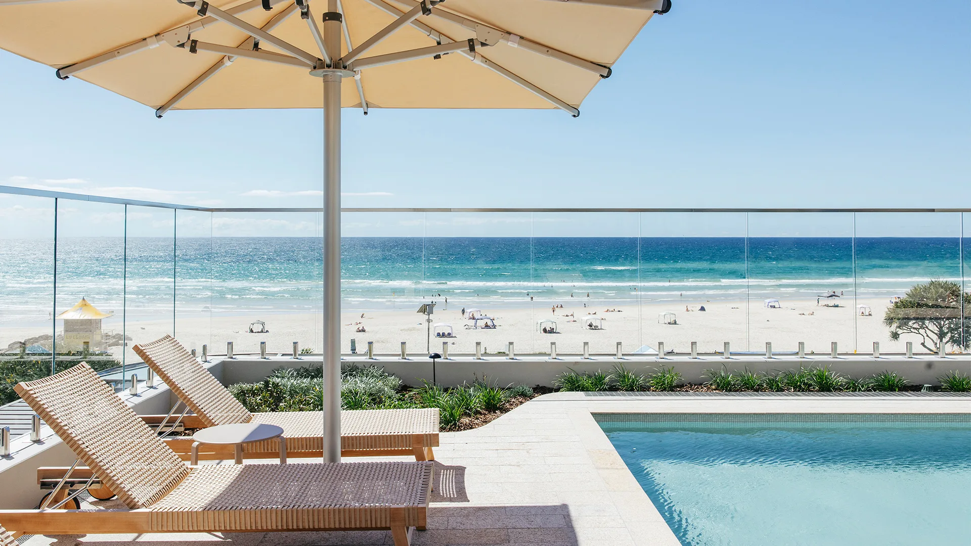Pool area and beachfront at Kirra Point.