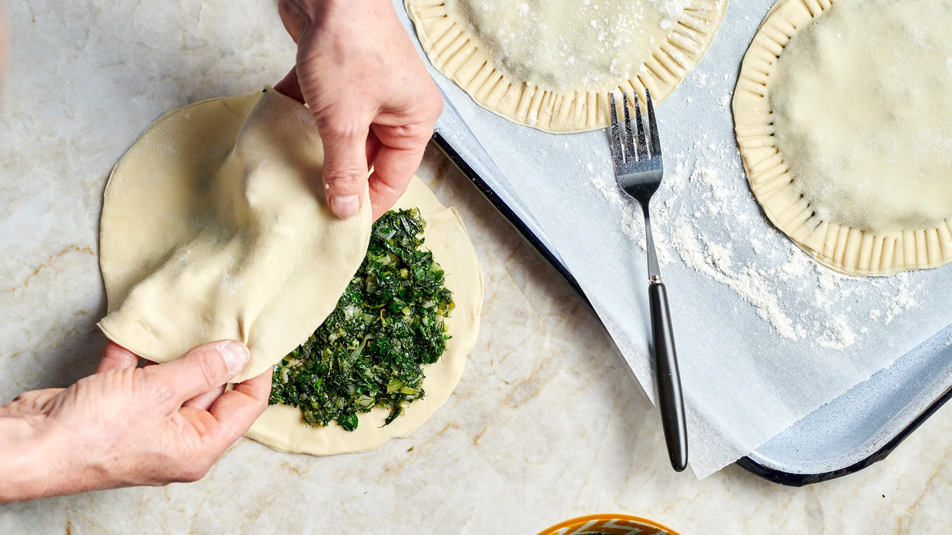 Enclosing filling in fillo pastry.