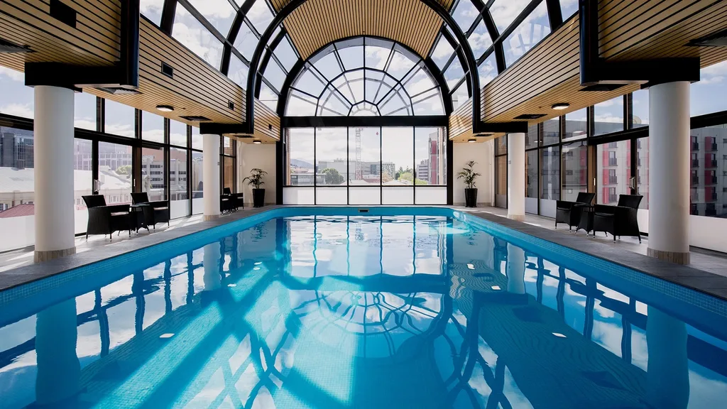 The indoor heated pool has scenic views at the Hotel Grand Chancellor, Hobart.
