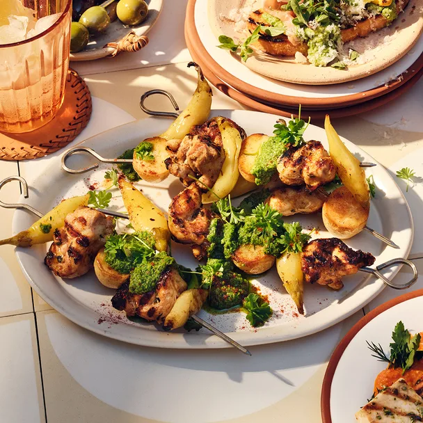 Spanish chicken and potato skewers with charred vegetable salad and mojo verde