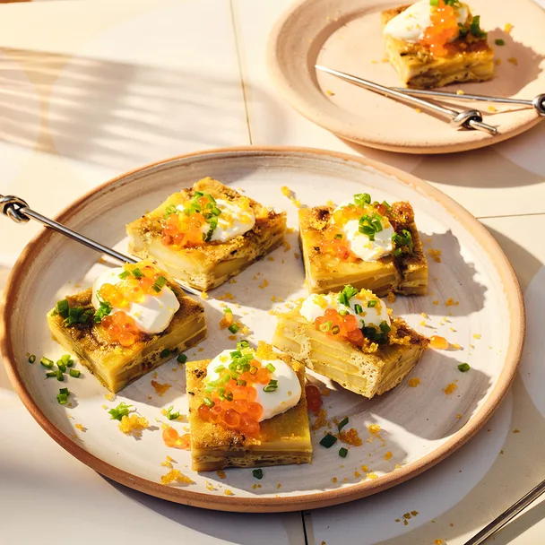 Potato and thyme tortilla with cr&egrave;me fra&icirc;che, salmon roe and bottarga