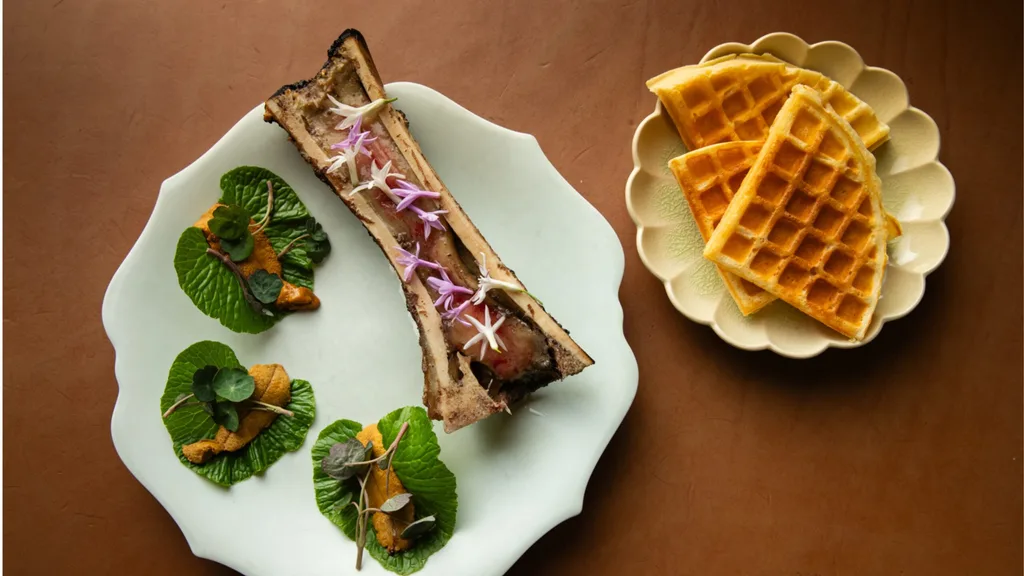 Waffles served with smoked butter, roasted bone marrow, uni and wasabi leaf.
