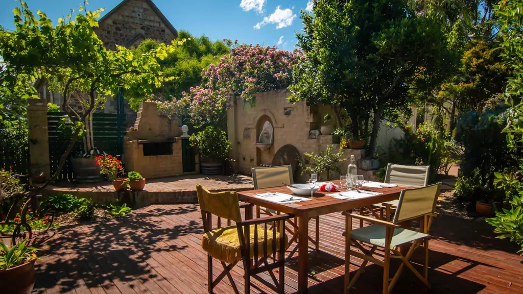 The Tuscan-inspired, private courtyard at Queen Bee Cottage in Milton is ideal for some small town romance.