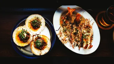 Baked scallops with toum butter; baked prawns, makrut coconut curry and lime
