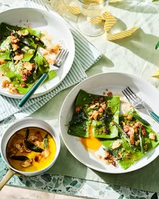 Rocket and egg yolk ravioli with pancetta and sage