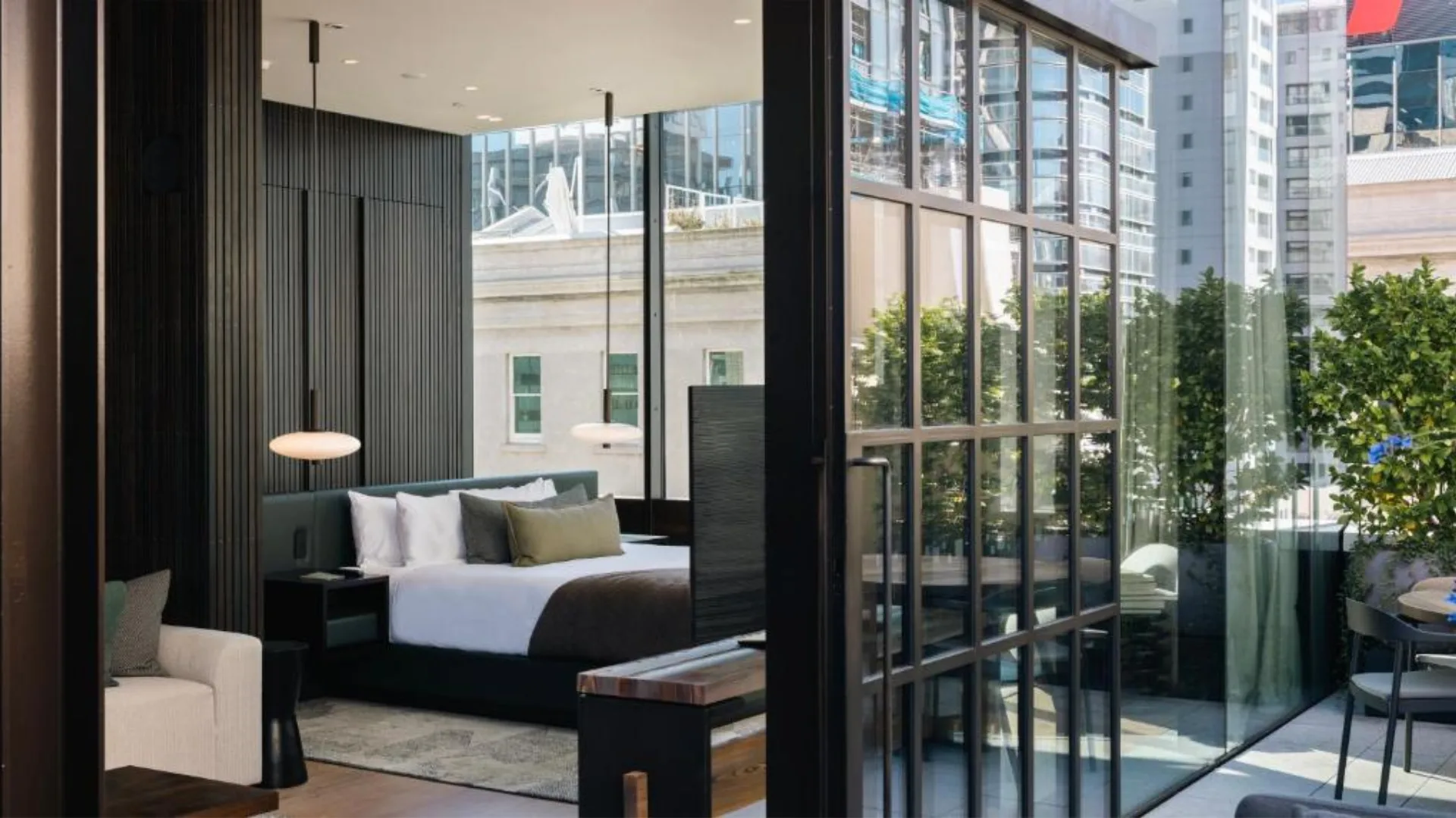 The bedroom with outdoor terrace at the Hotel Britomart, one of the best hotels in Auckland New Zealand