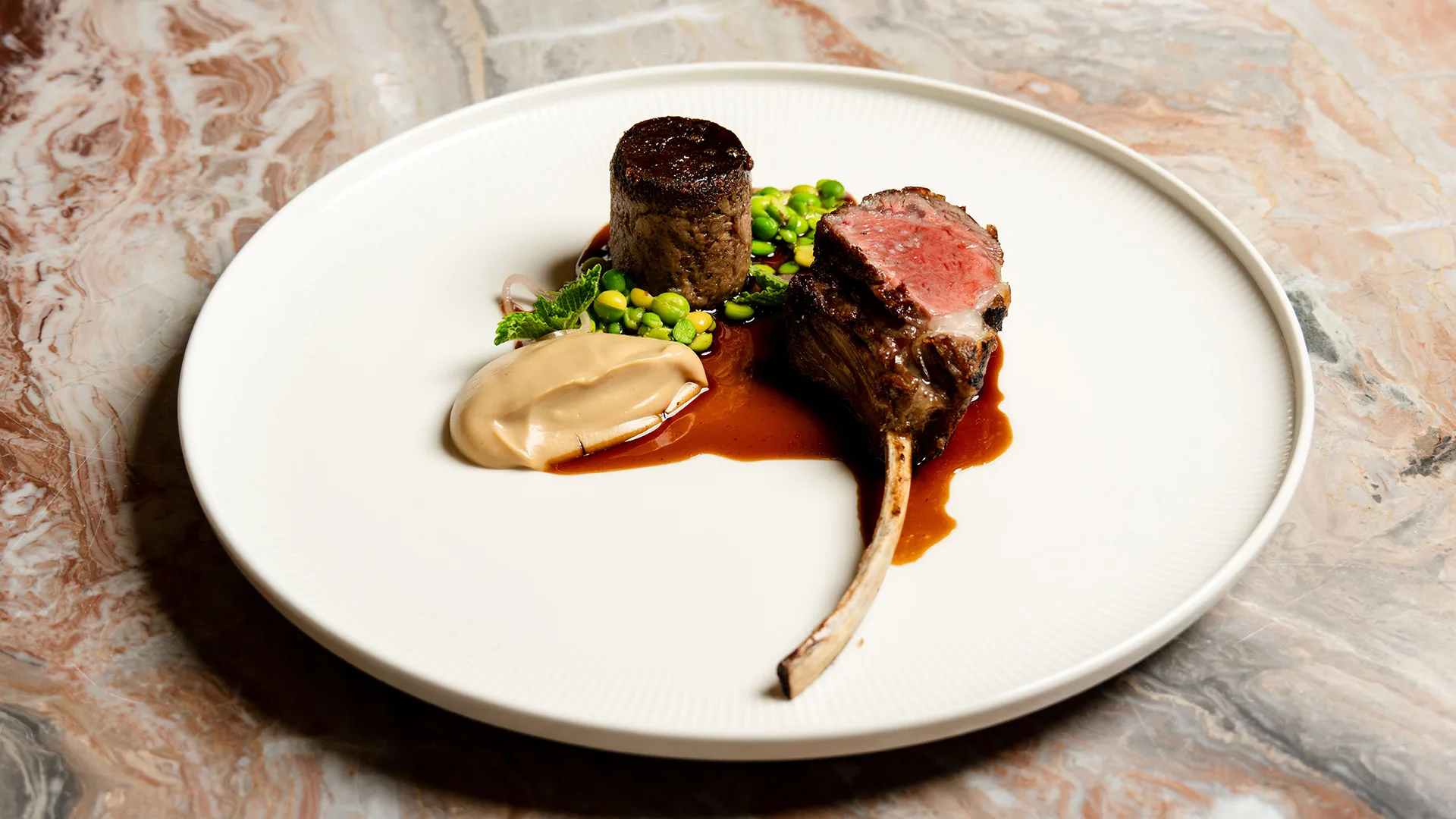 Marga lamb rack, braised shoulder, peas, cauliflower, mint