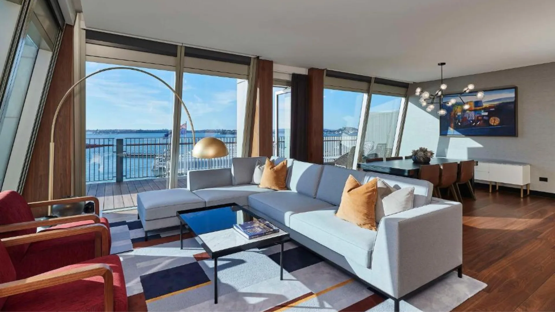 The living room and deck at Park Hyatt Auckland hotel