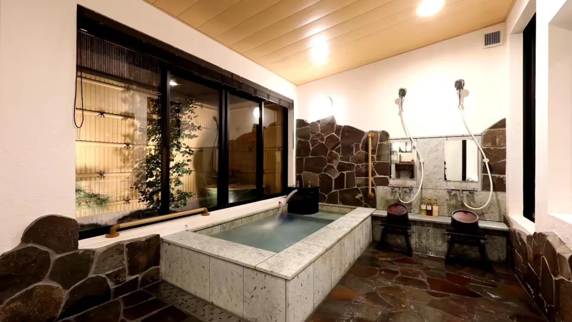 The traditional Japanese onsen bath at Shukuhonjin Airbnb in Osaka