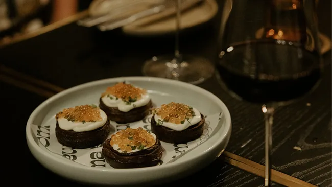 A close-up shot of potato rosti, creme fraiche, yarra valley caviar, chives from Bar Soma in Hervey Bay, Queensland