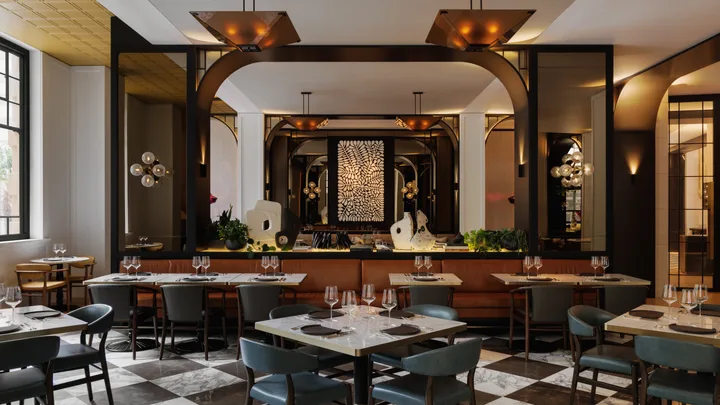 The interior of the bistro-style restaurant with checkered floors at Capella Sydney.