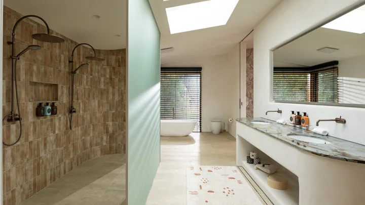The spacious neutral-toned bathroom at The Chalets at Blackheath in the Blue Mountains.