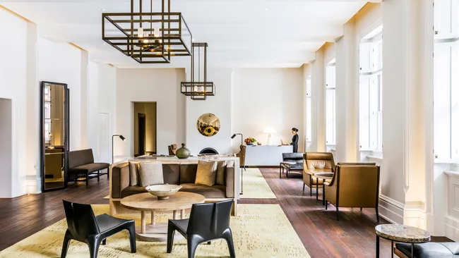 The elegant, neutral-toned interiors at the Arrivals Lounge at Como The Treasury, Perth