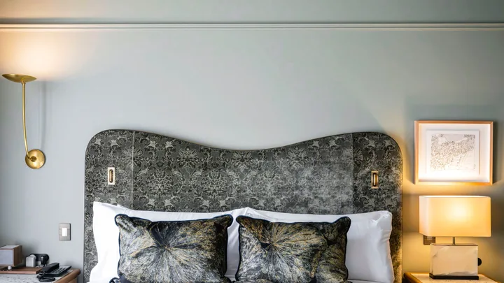 The cool grey tones of the bedroom suite at The Grand National Hotel, Paddington