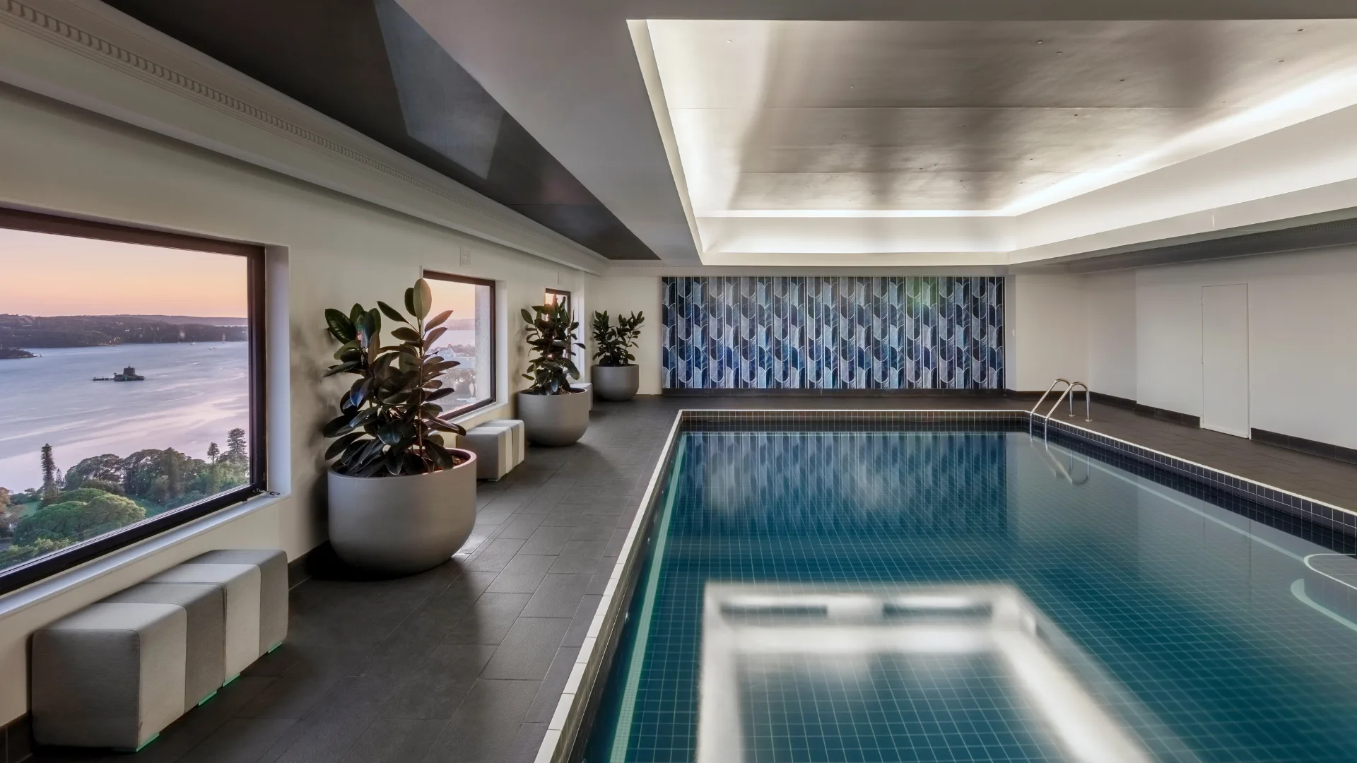 The indoor pool at Intercontinental Sydney with views of the harbour