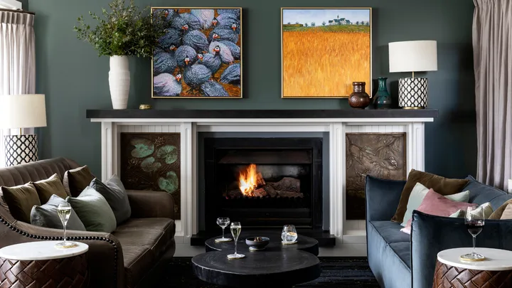 The plush interior of the Argyle Bar with an open fire at Lake House