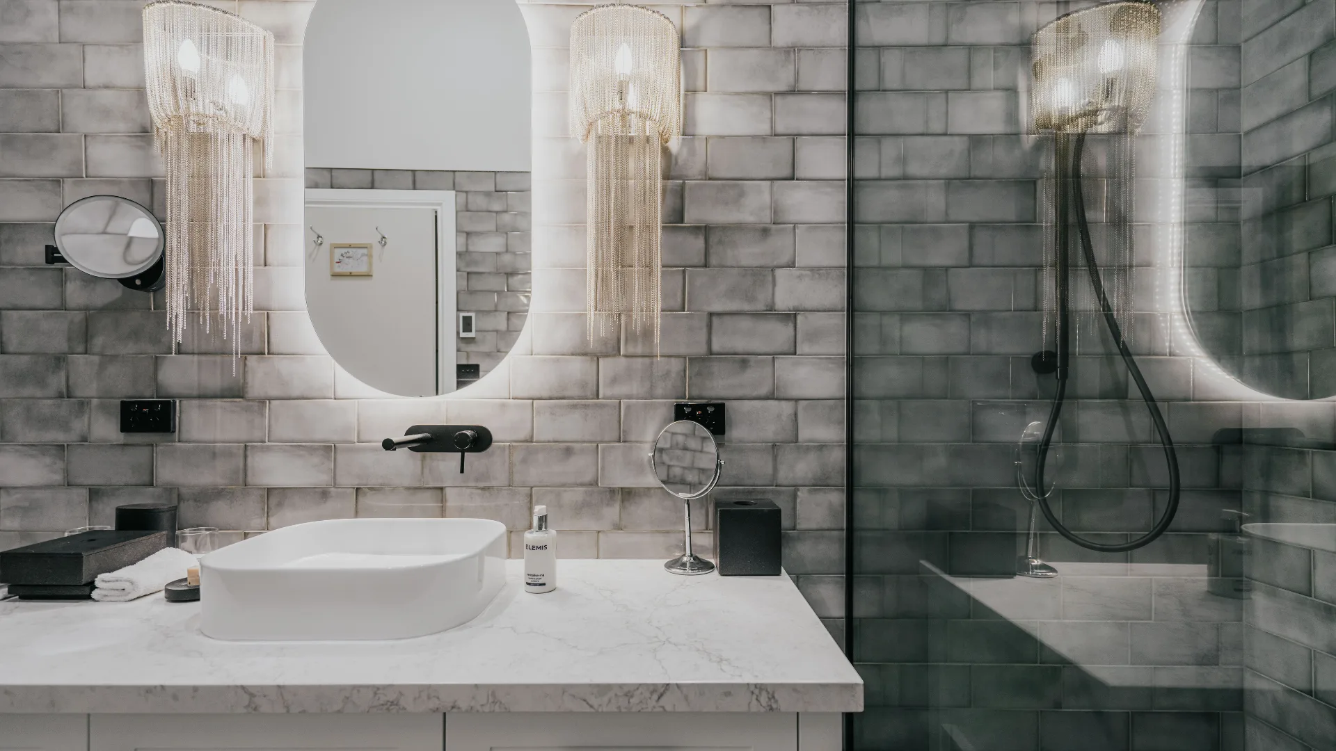 Modern bathroom with grey tiles at the Lake House Lodge