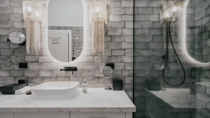 Modern bathroom with grey tiles at the Lake House Lodge