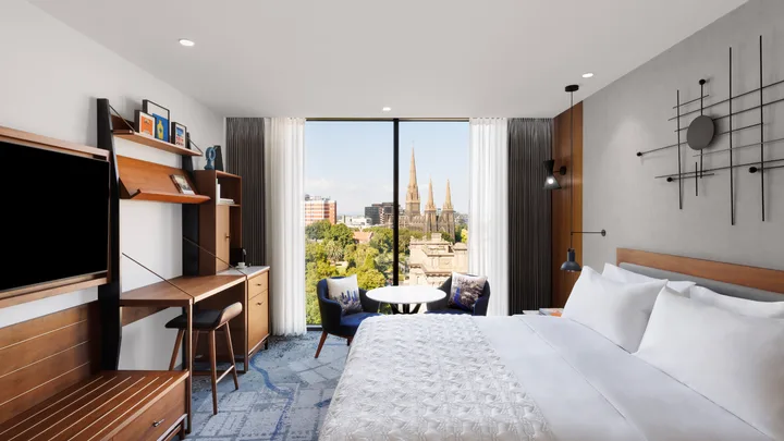 The clean white interior of the Garden View rooms at Le Méridien Melbourne