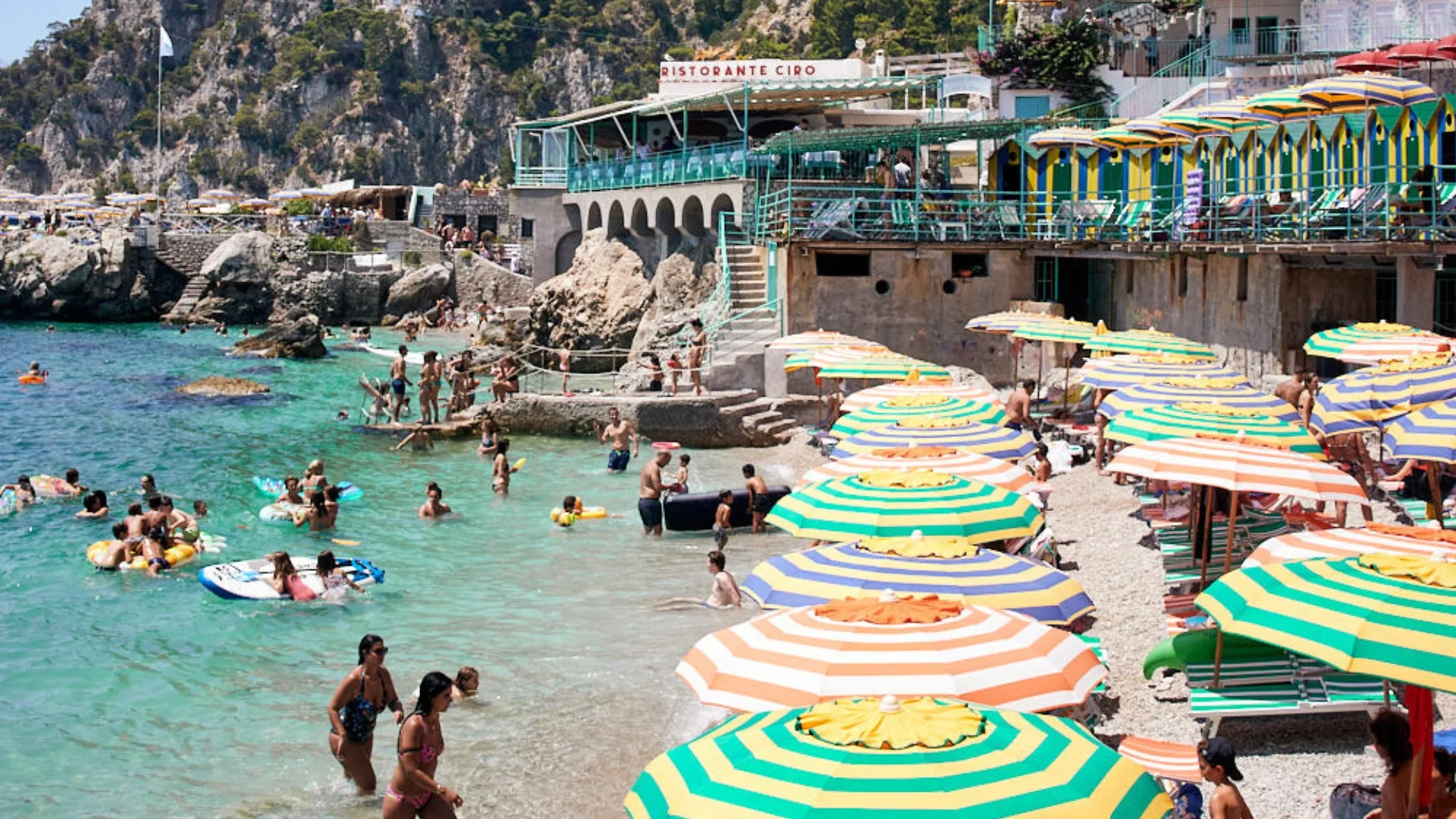 Capri beach umbrellas at blue ocean