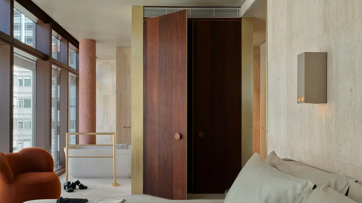 Classic neutral interiors of the bedroom at one of the Suites at Hyde Melbourne Place