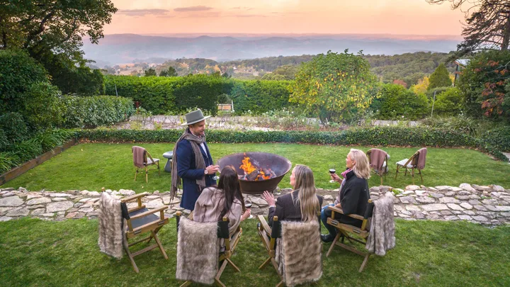 Enjoying an open fire pit outdoors overlooking the garden at Mount Lofty House