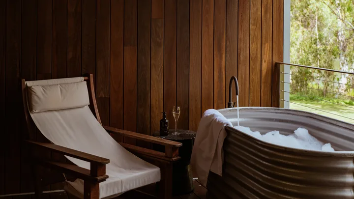 The corrugated outdoor bathtub on the verandah at one of the private suites at Mount Mulligan Lodge.