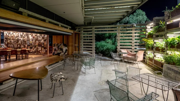 The Mosaic Room lounge area leads out onto a patio at Ovolo Nishi, Canberra.