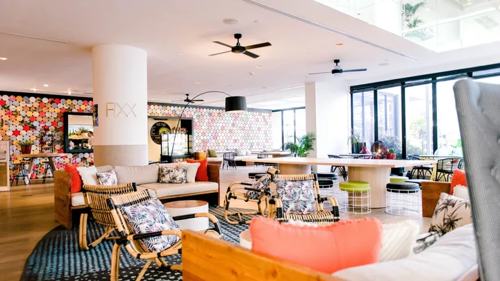 The bright tropical-style interiors of Fixx Cafe at QT Gold Coast