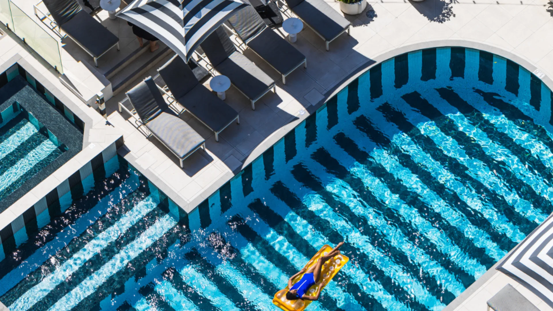 The black-striped rooftop pool at QT Gold Coast