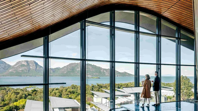 Panoramic mountain views from the floor-to-ceiling windows of the lobby at Saffire Freycinet