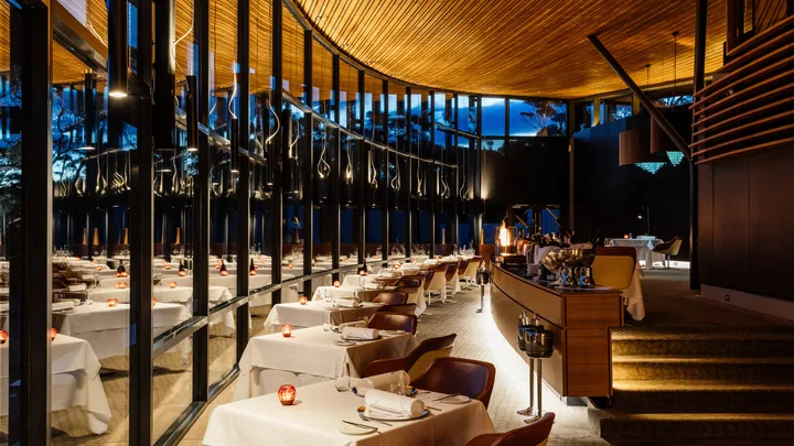 Palate restaurant interior with floor to ceiling windows and a modern design at Saffire Freycinet