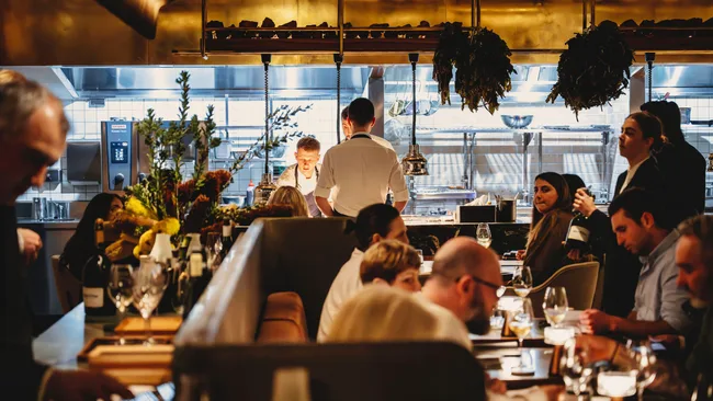 The busy dining room at Saint Peter restaurant at The Grand National Hotel, Paddington.