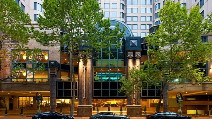 The elegant exterior of the Sheraton Grand Sydney overlooking Hyde Park in the city