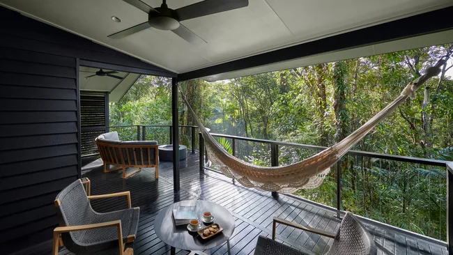 A hammock hangs on the balcony at the Billabong Suite, at Silky Oaks Lodge, Daintree