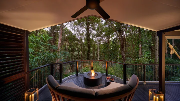 A fire pit lights up the night on the balcony of the Billabong Suite, at Silky Oaks Lodge, Daintree