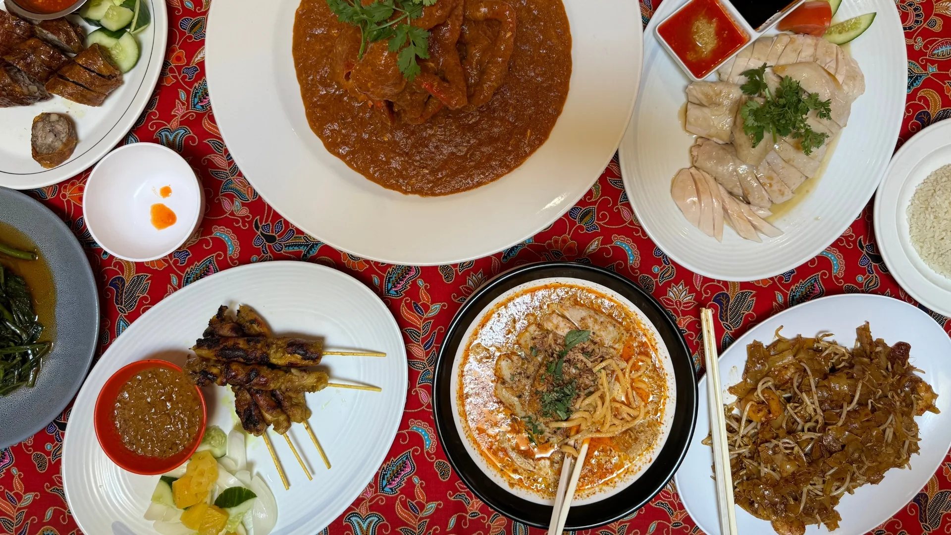Singaporean and Malaysian dishes line the table at Temasek in Parramatta