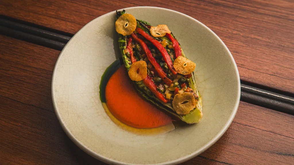 Charred cos, olasagasti anchovies, bullhorn peppers, capers, garlic crisps, red pepper sauce at Firedoor