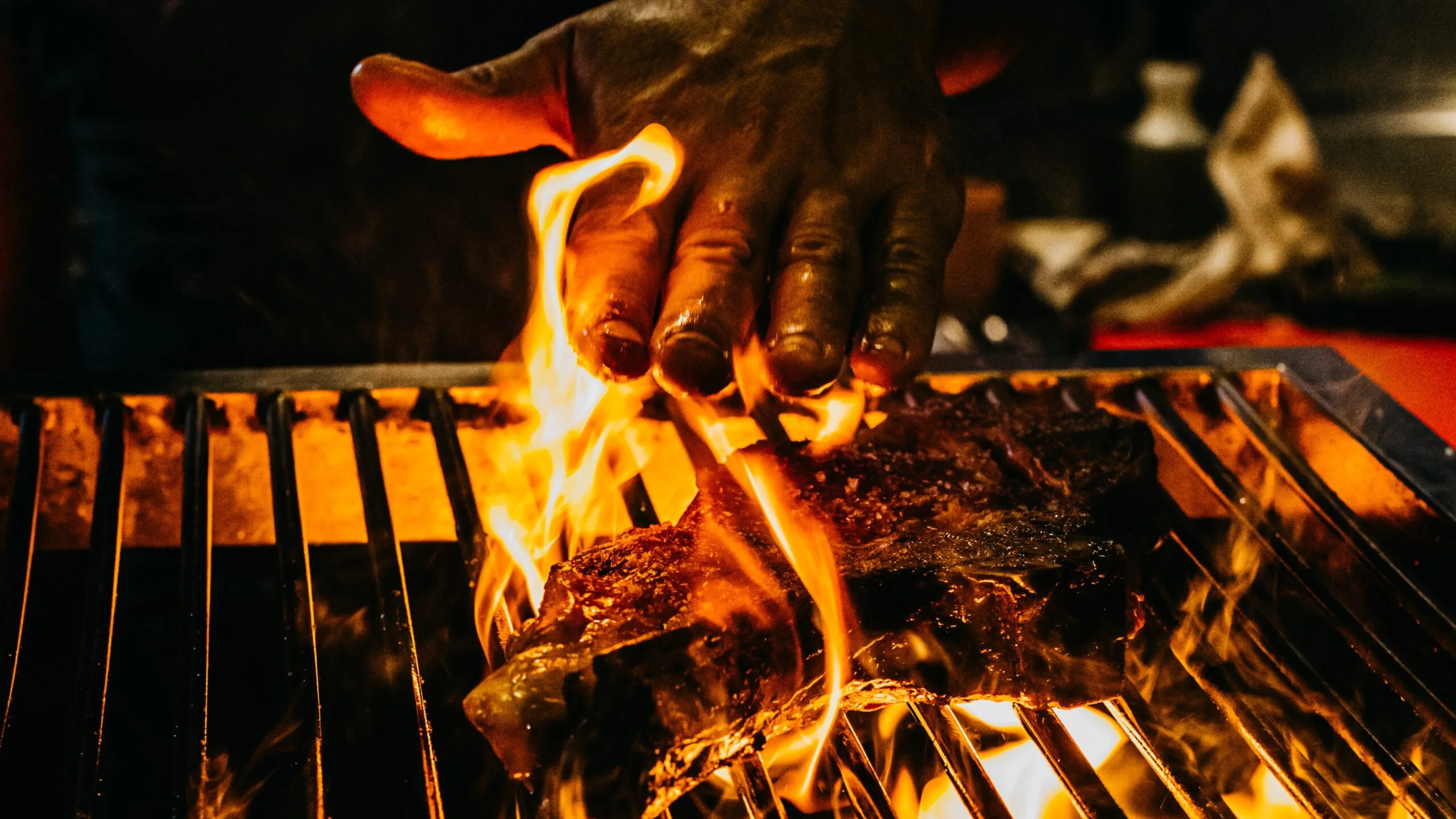 Lennox Hastie cooking steak over fire at Firedoor.