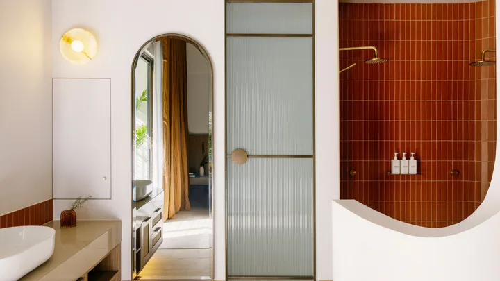 The curvy lines of the bathroom at Basq House in Byron Bay.