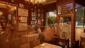 Corner 75 restaurant interior with red walls and memorabilia
