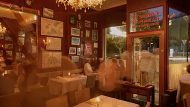 Corner 75 restaurant interior with red walls and memorabilia